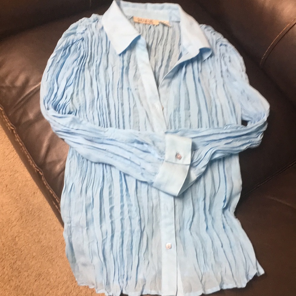 This is a long sleeve blue dress shirt.